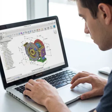 Student creating a 3D model in CAD software
