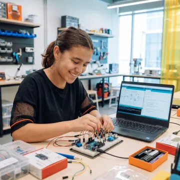 Electronics student building a control system project