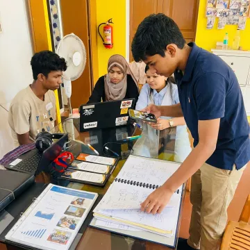 Student documenting a hands-on project