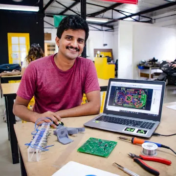 Learner working on PCB design and soldering