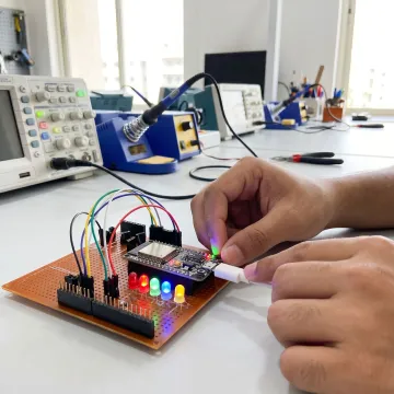 Student testing embedded code on electronics hardware