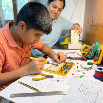 Student building a prototype during a short course
