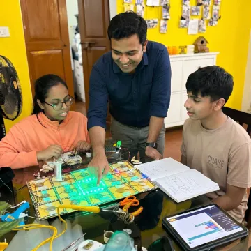 Educator guiding a project-based learning activity