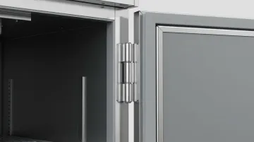 Commercial foodservice equipment door with full-length continuous piano hinge installed