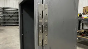 Pin-and-barrel continuous hinge installed on commercial cabinet door panel