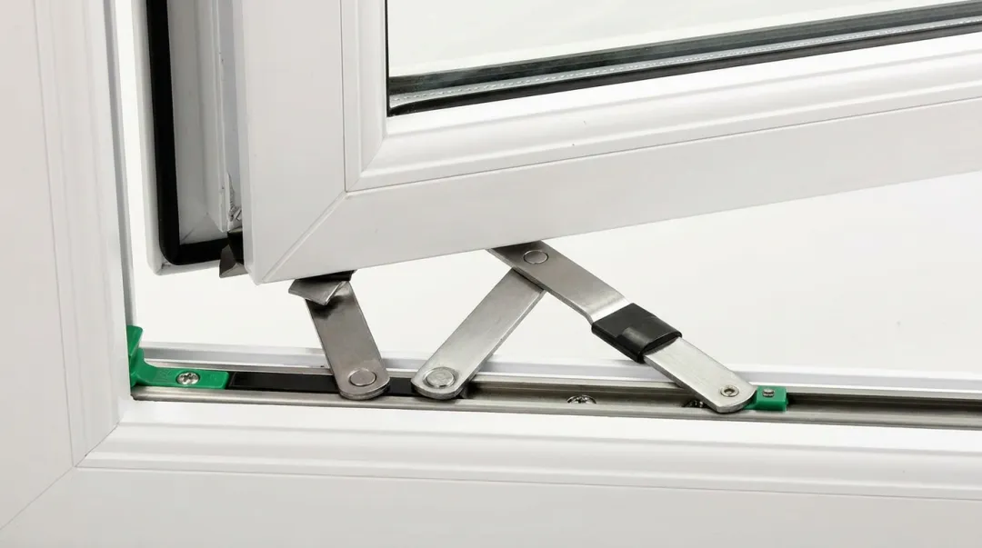 Close-up of friction hinge mechanism installed on uPVC casement window frame
