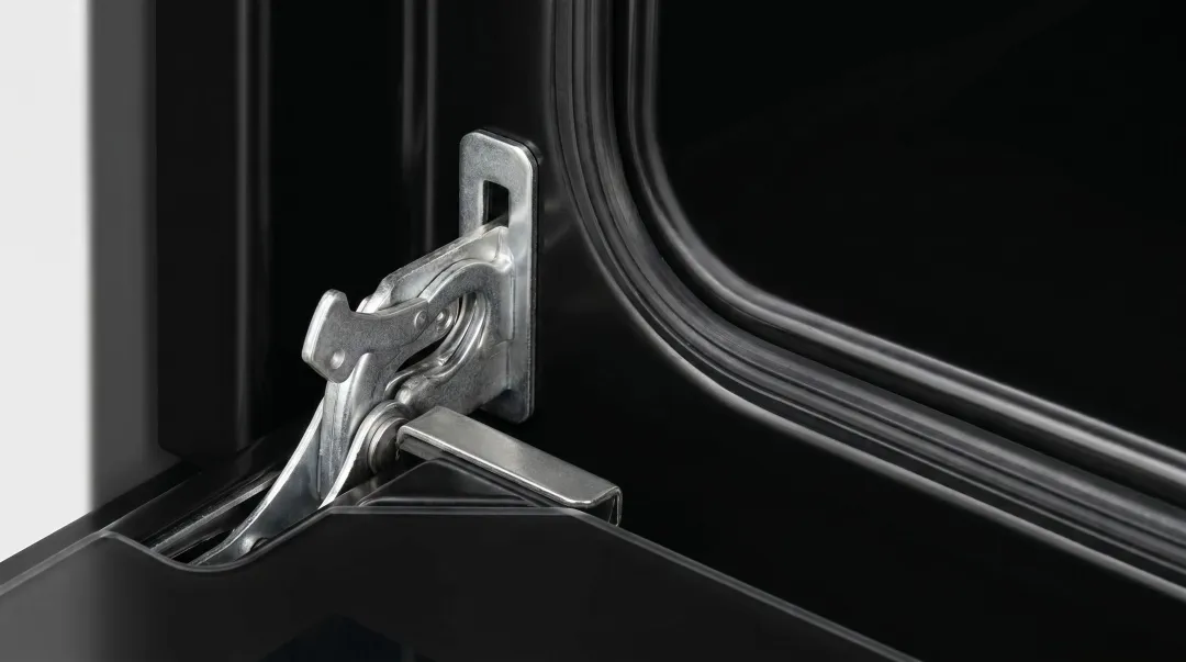 Appliance oven door gasket seal alignment showing gap measurement and hinge wear