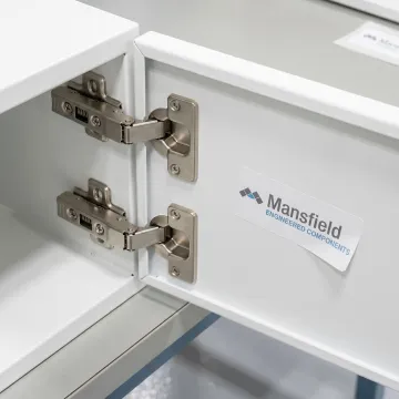 Medical storage cabinet hinges in production
