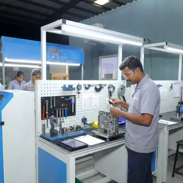 Technician inspecting assembled industrial module