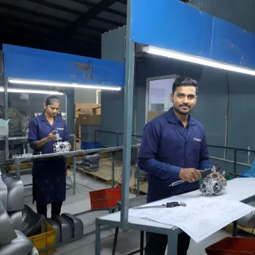 Engineers inspecting investment cast parts