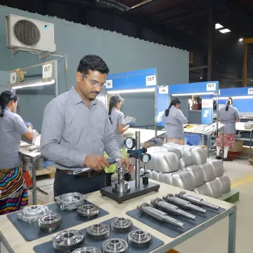 Technician inspecting assembled industrial components
