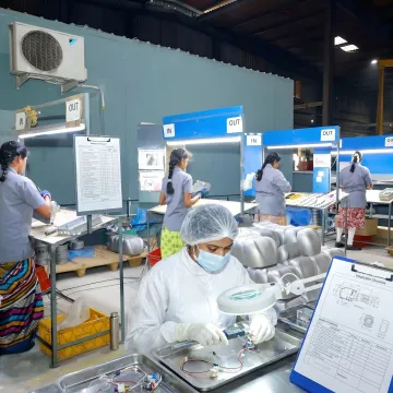Technician inspecting assembled medical components