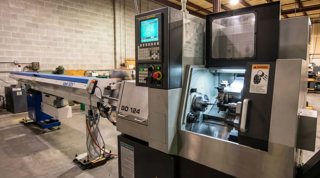 Modern Swiss CNC screw machine in production shop floor manufacturing environment