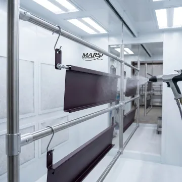 Custom fluoropolymer powder coating on precision metal parts