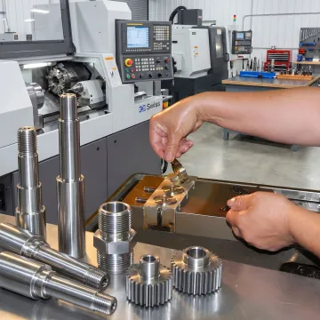 Precision turned metal components in a machine shop