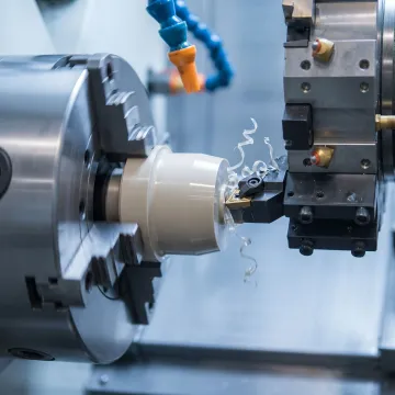 Precision aerospace plastic turned part being machined