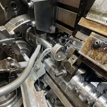Precision aluminum screw machining in progress