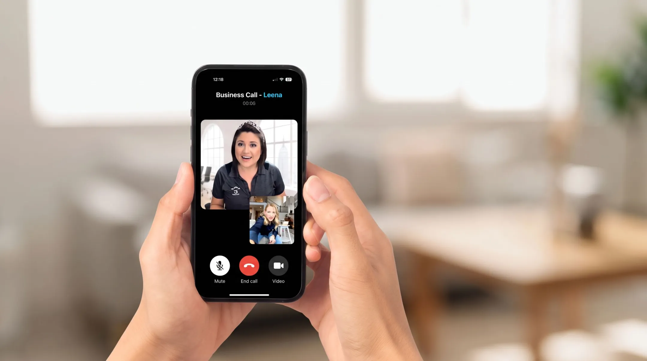 Employee taking business call on mobile app while working remotely