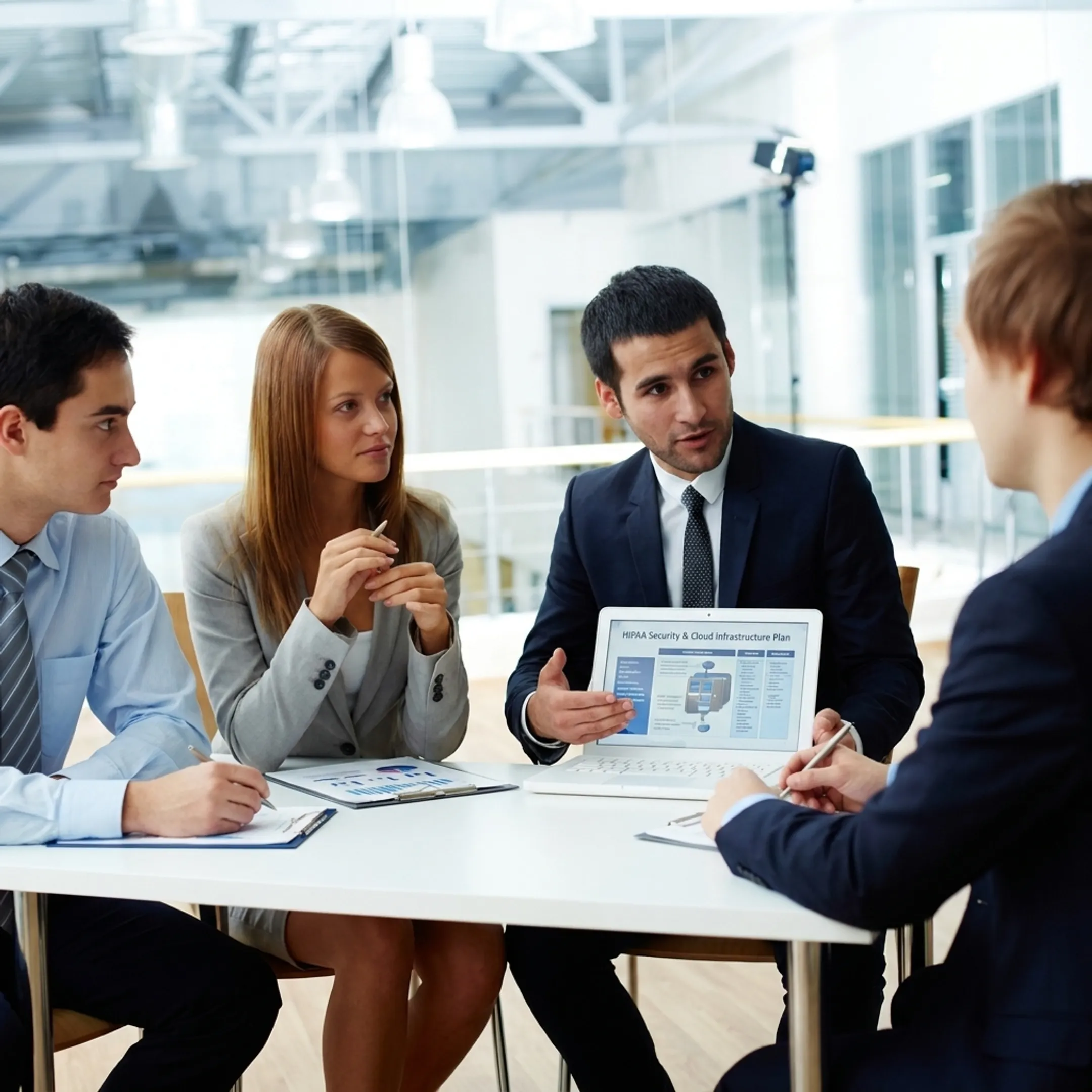 Consultant discussing secure IT plan with business team