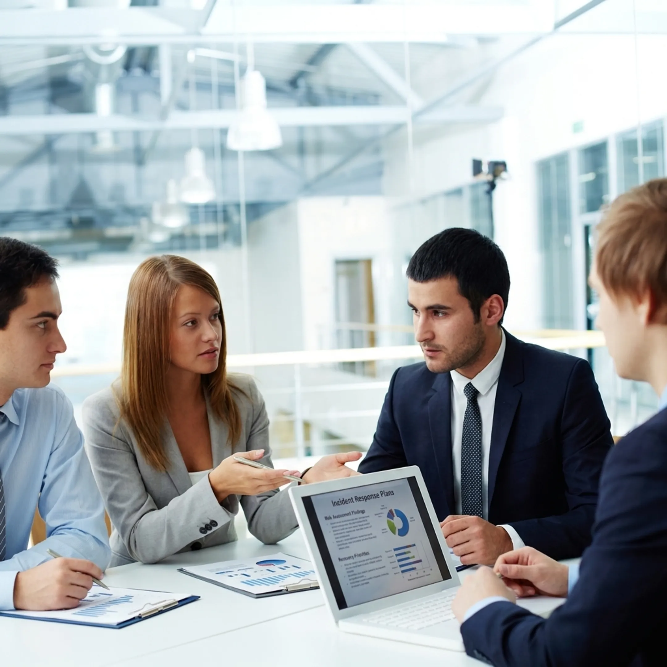IT advisor discussing cybersecurity response planning with business leaders