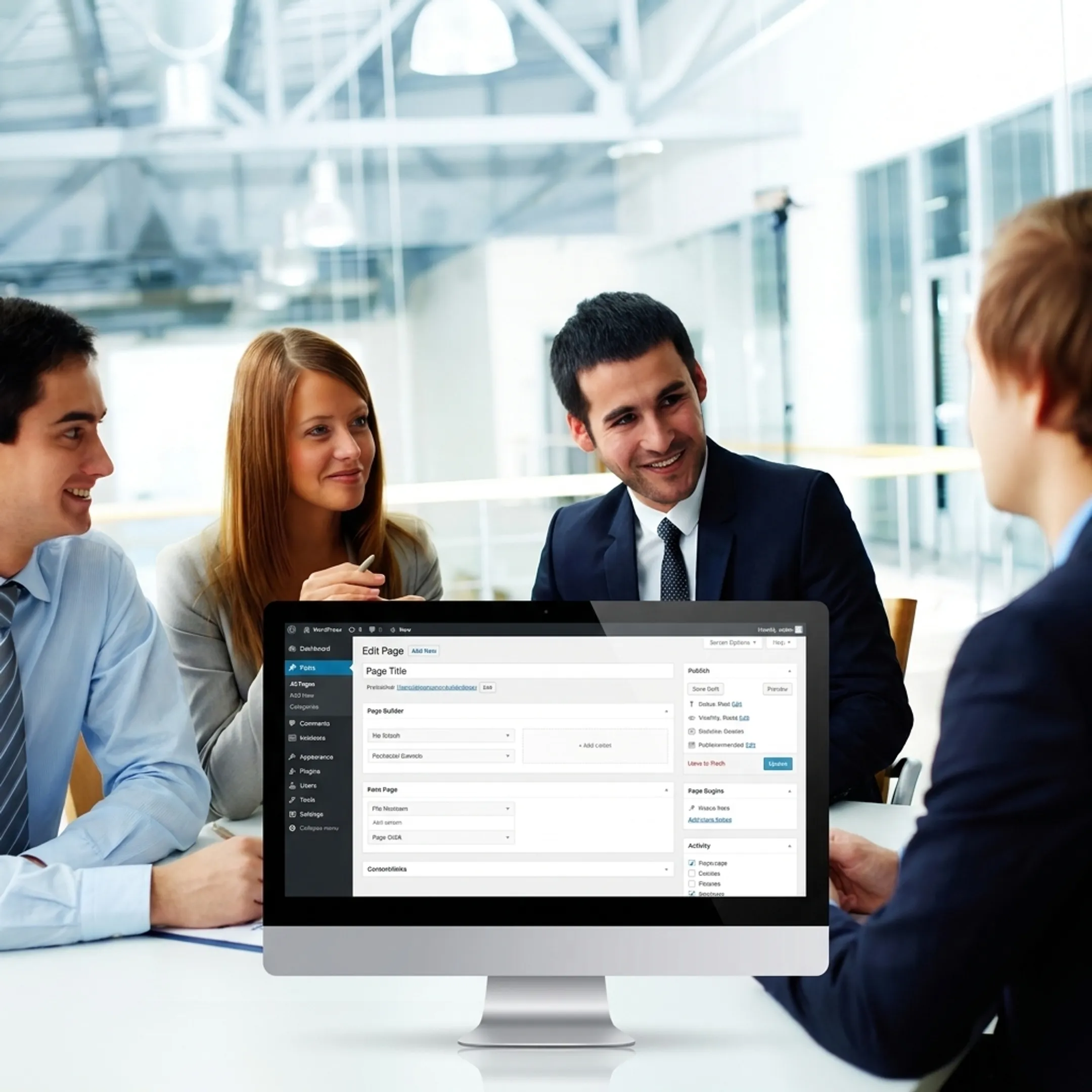 Team planning a WordPress website on a desktop monitor