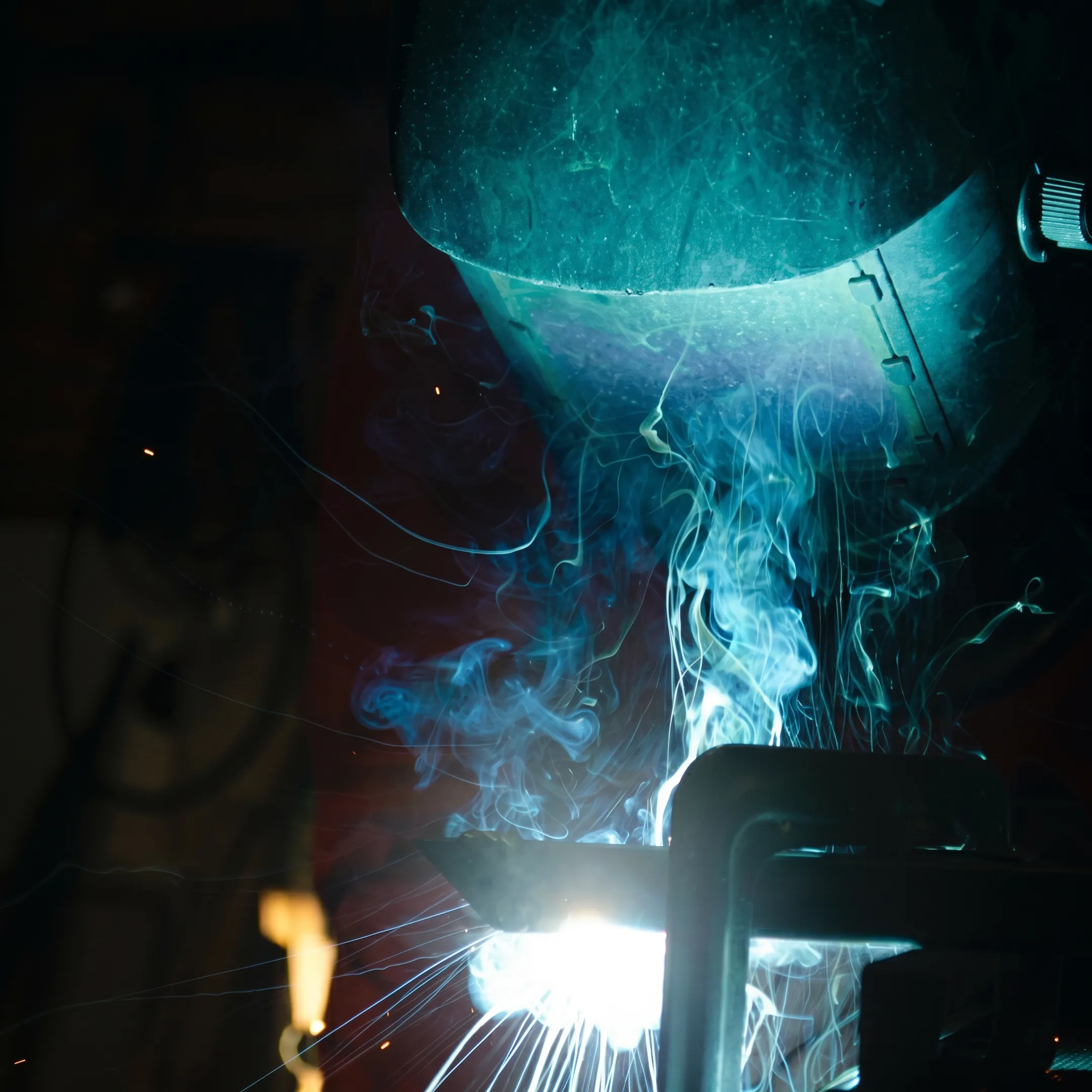 Industrial fabricators building custom stainless equipment in a manufacturing facility