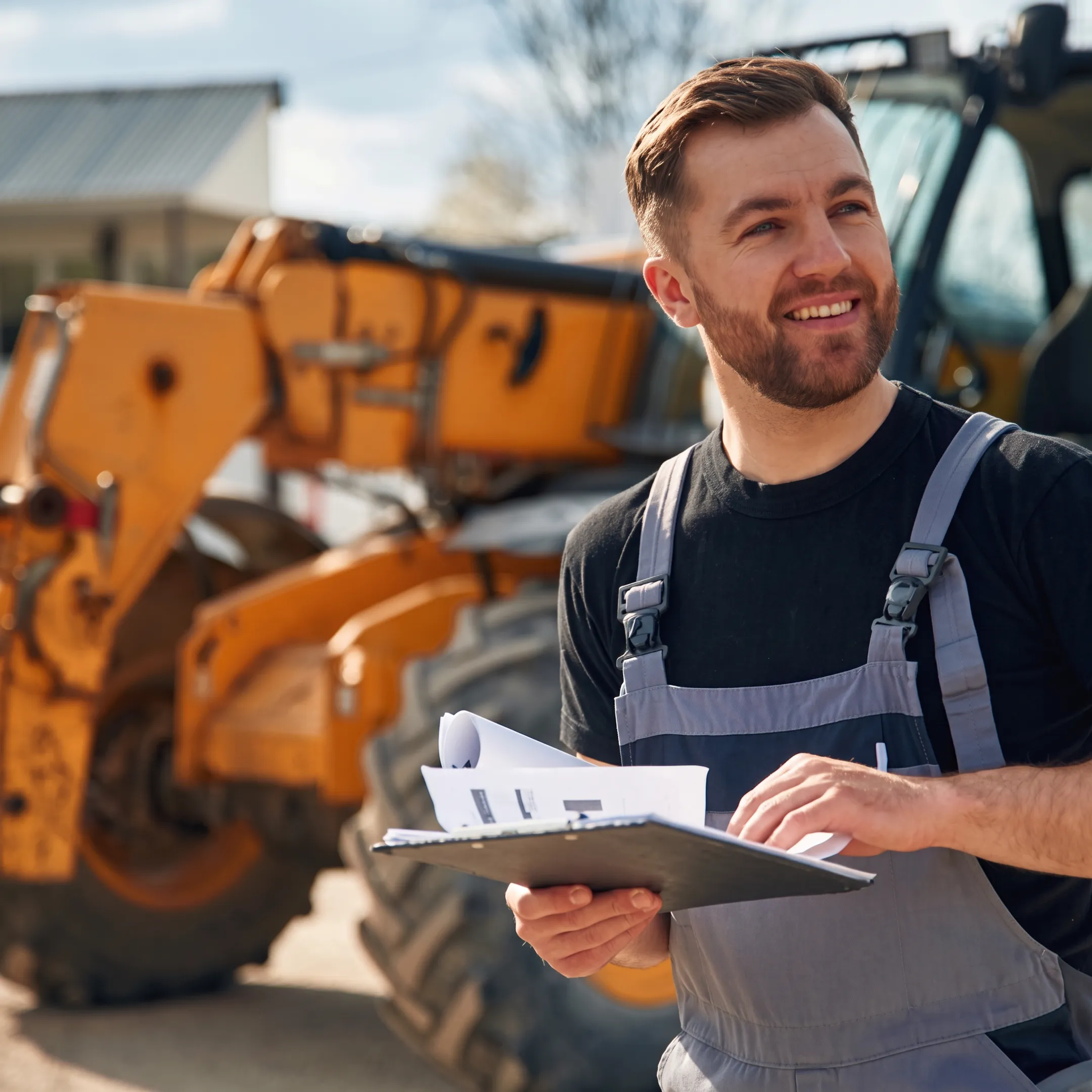 Factory-trained technician inspecting a heavy equipment hydraulic system