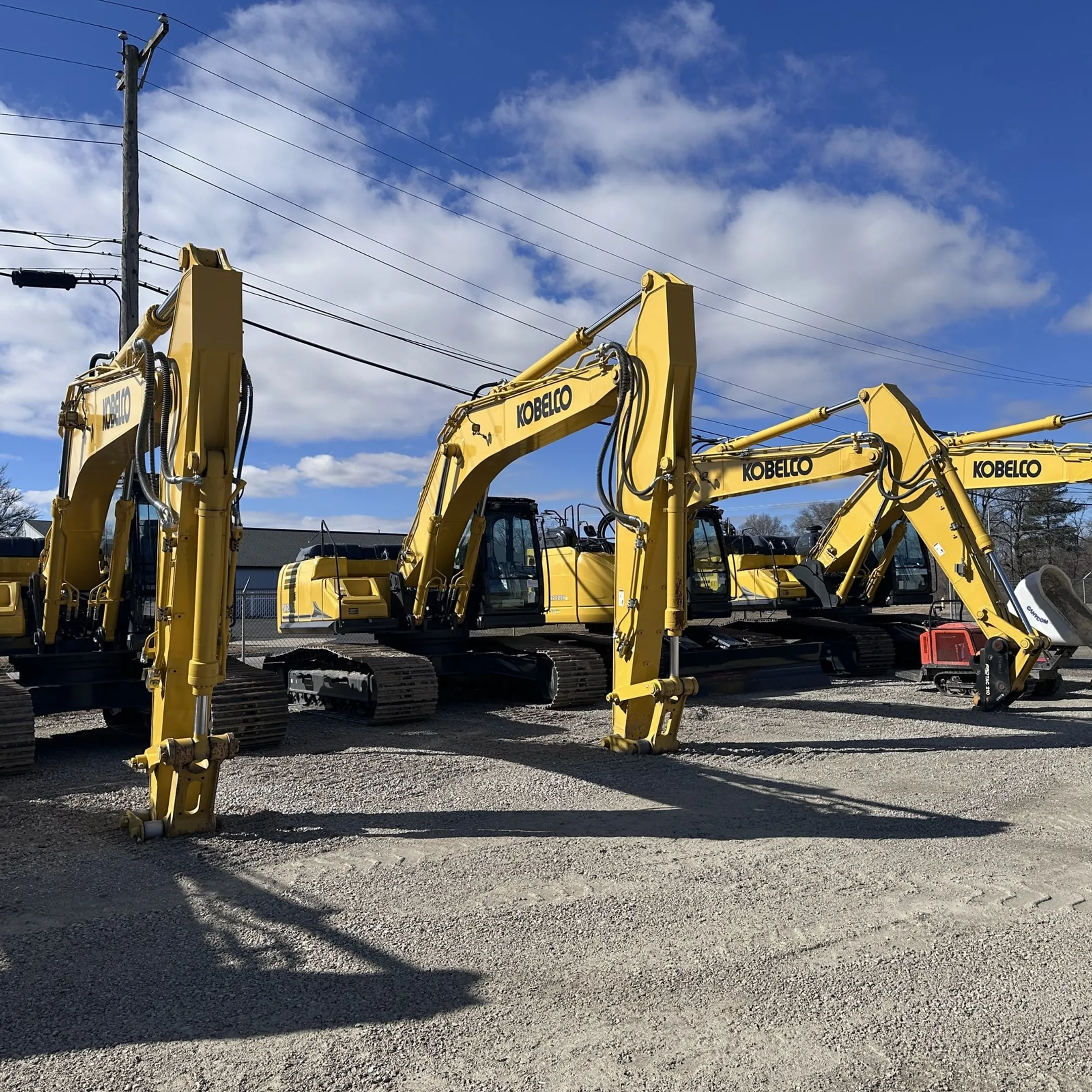 Fleet manager viewing construction equipment telematics dashboard on a laptop