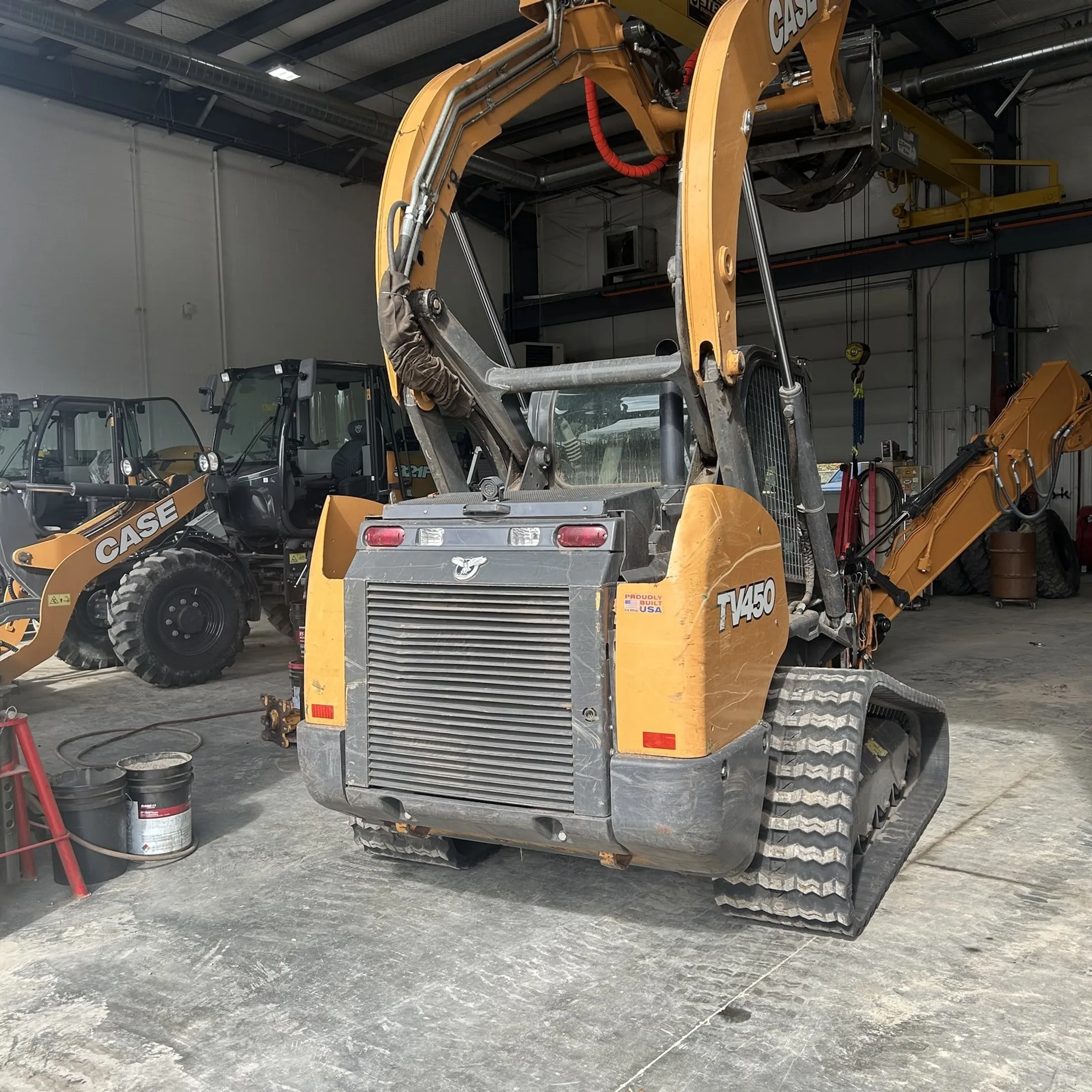 Technician repairing a hydraulic cylinder for heavy construction equipment