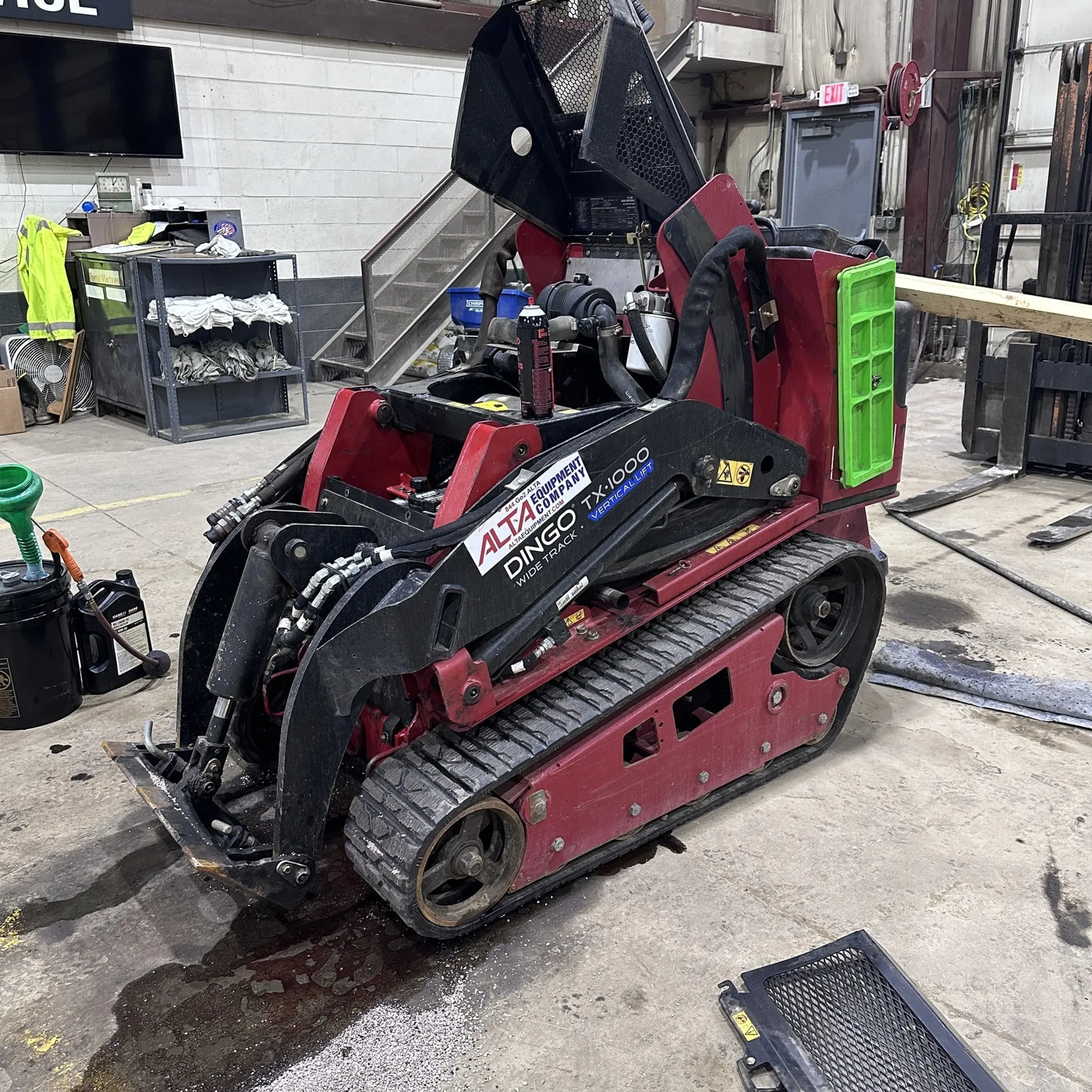 Technician rebuilding a hydraulic motor for construction equipment