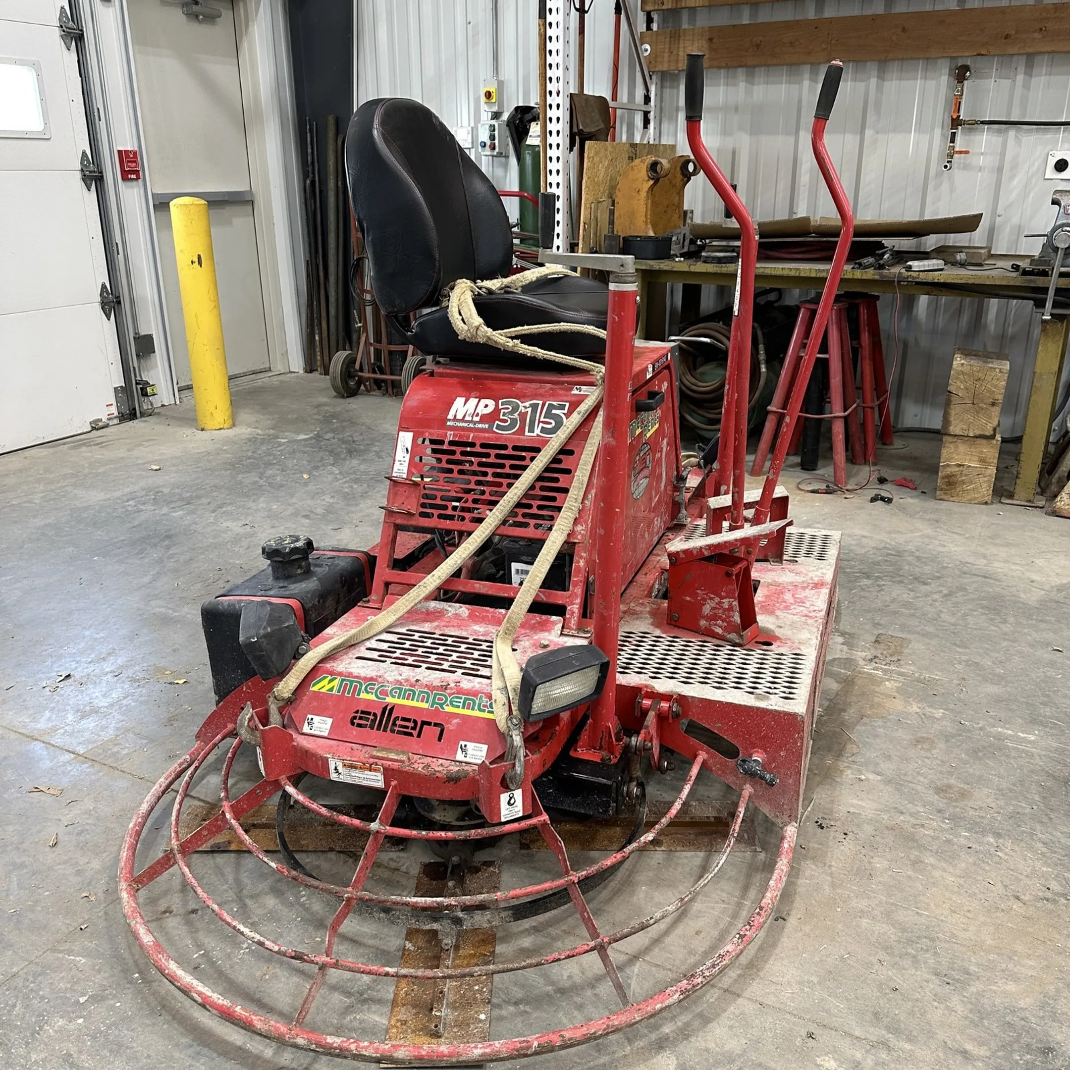 Technician testing a construction tool with professional diagnostic equipment