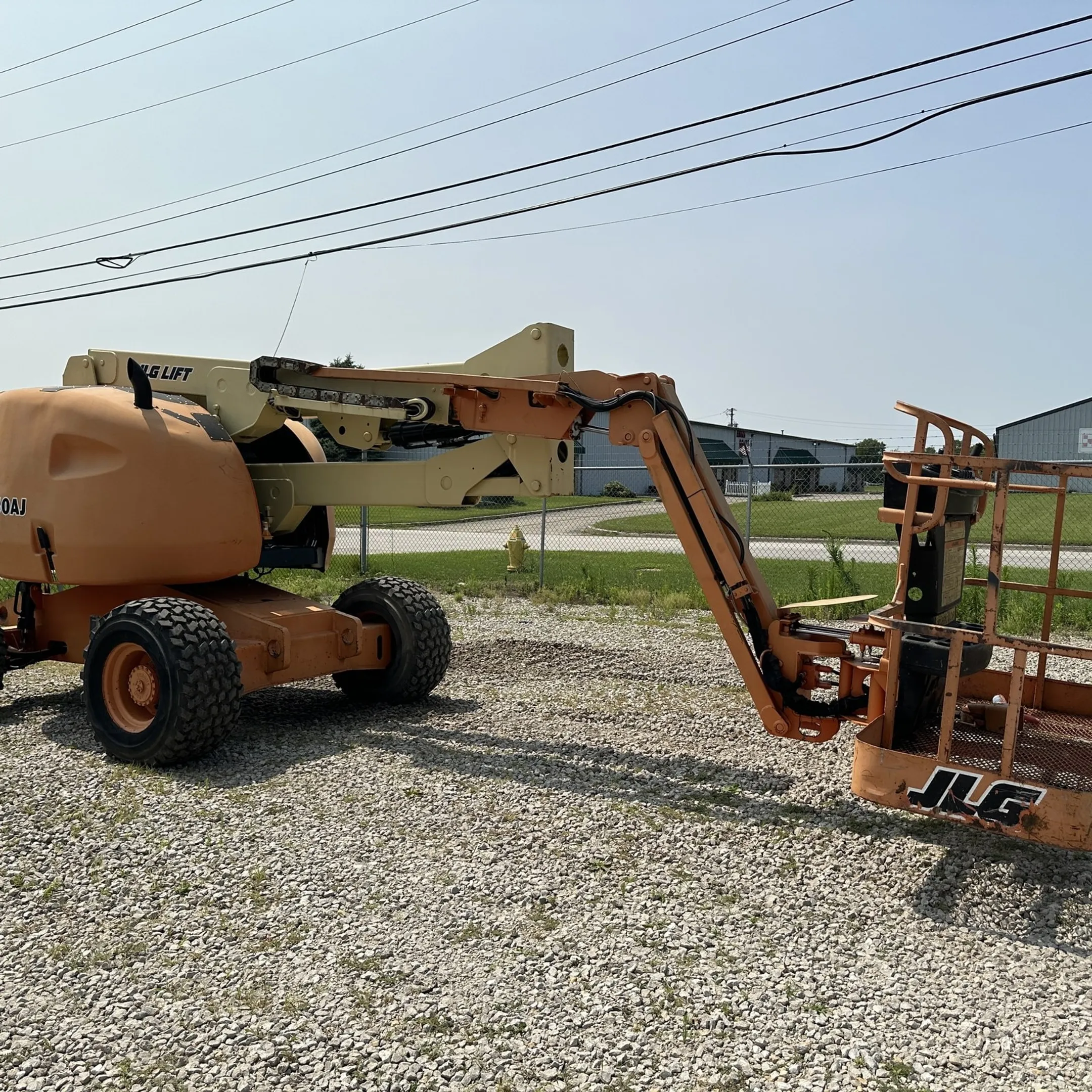 McCann technician diagnosing aerial lift hydraulics