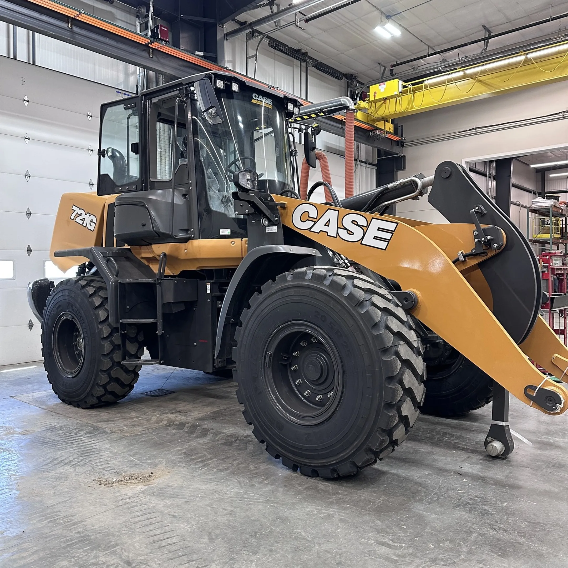 Fleet manager viewing construction equipment telematics on a laptop
