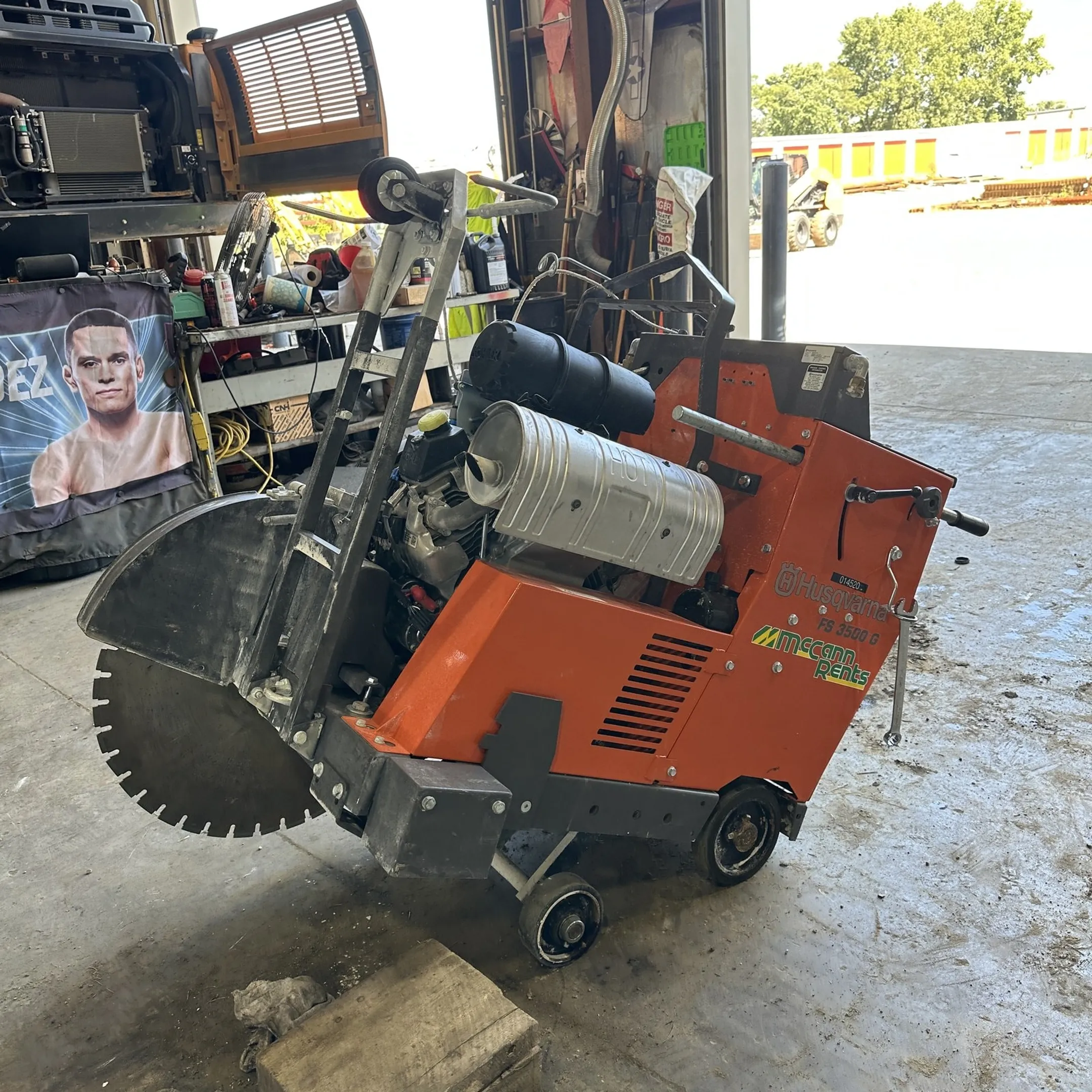 Technician diagnosing a construction power tool with professional testing equipment