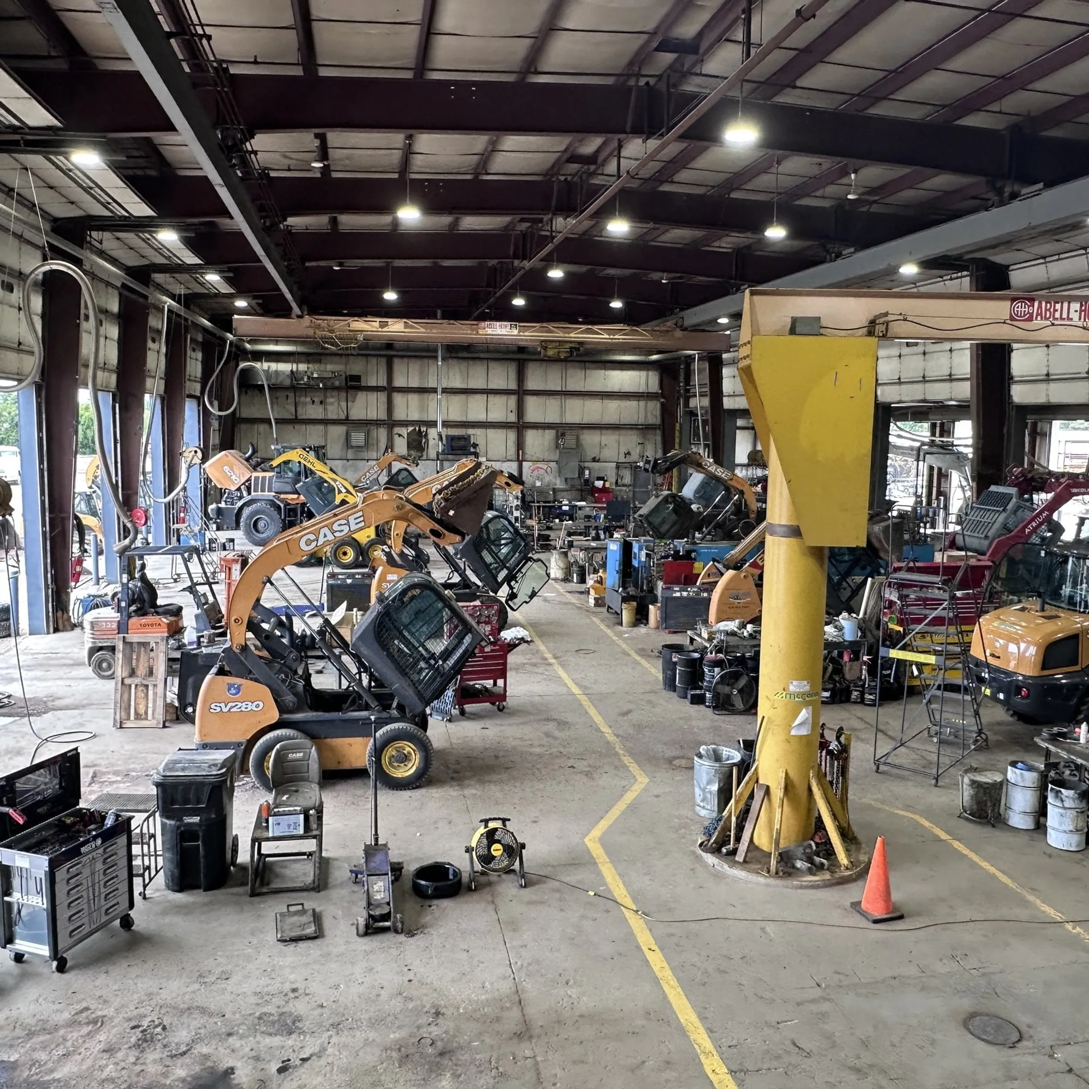 Fleet manager viewing telematics reports and equipment alerts