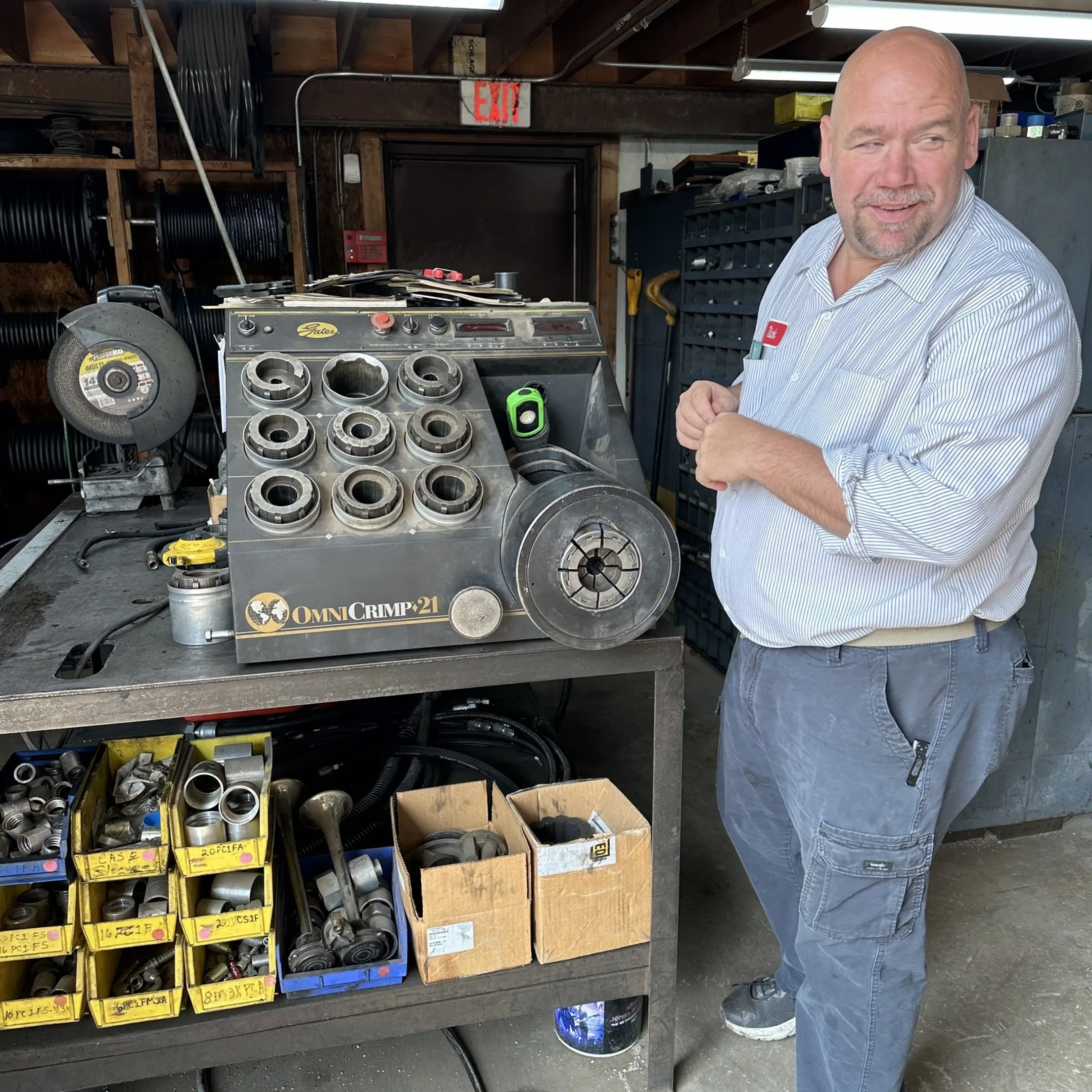 Technician inspecting forklift hydraulic components
