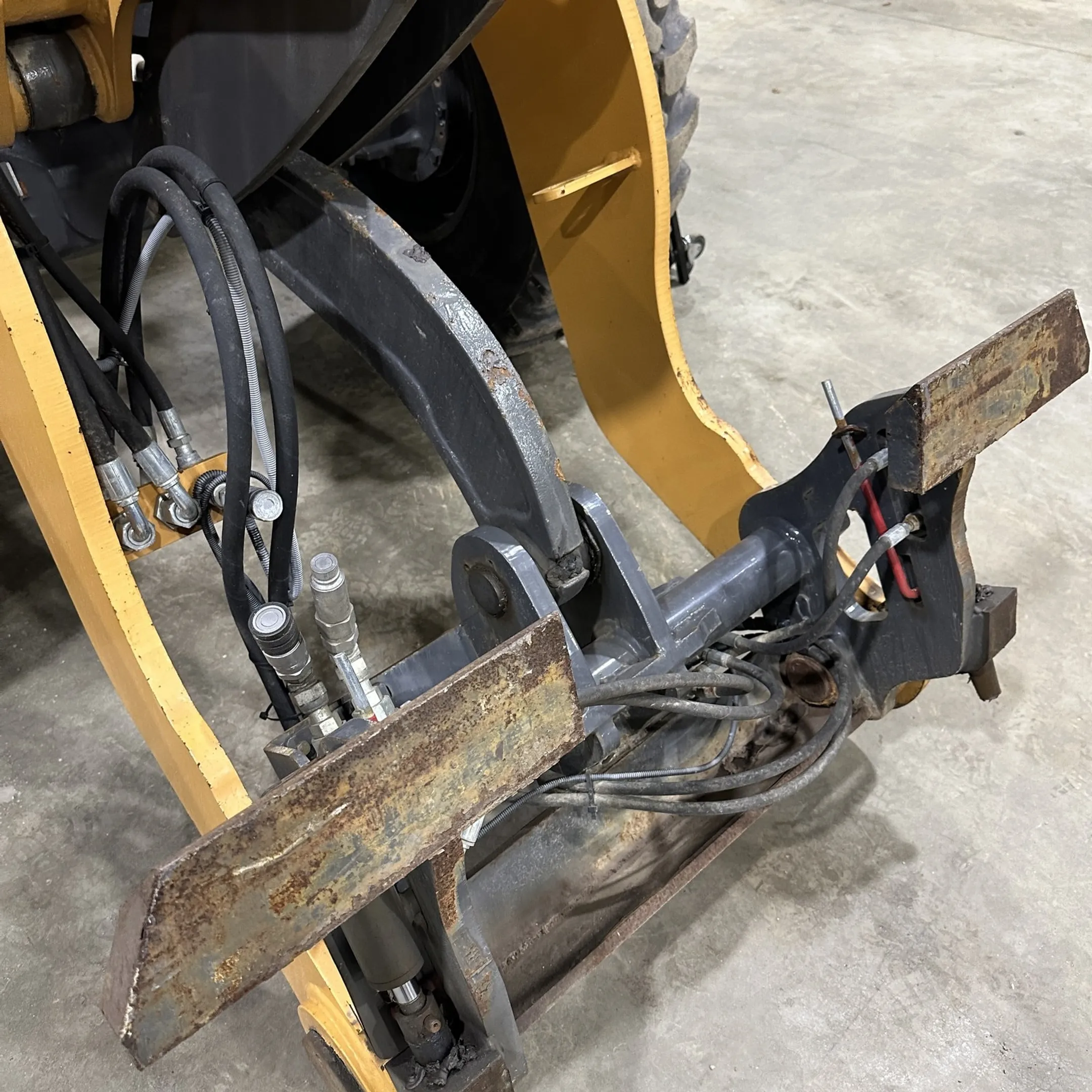 Technician diagnosing hydraulic equipment components