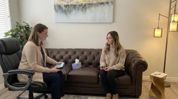 Therapist conducting EMDR therapy session with client in counseling office