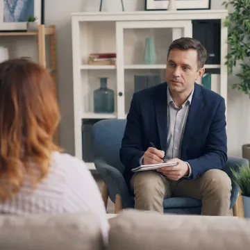 Therapist supporting client during anxiety counseling