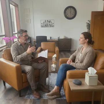Therapist and client reviewing a trauma therapy plan