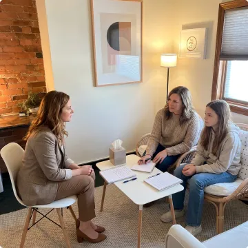 Adult and teen attending ADHD therapy session