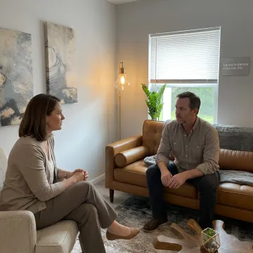 Therapist and male client in counseling session