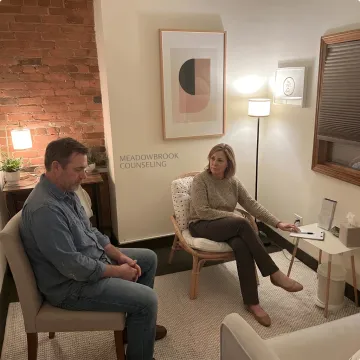 Therapist supporting a client during trauma counseling