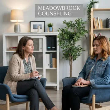Therapist offering trauma-informed counseling in a calm office