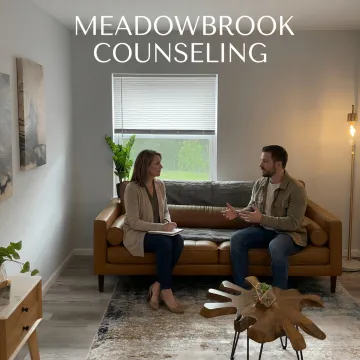 Therapist supporting client in counseling session