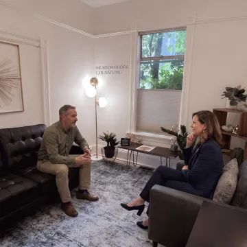 Counselor and client discussing goals during therapy