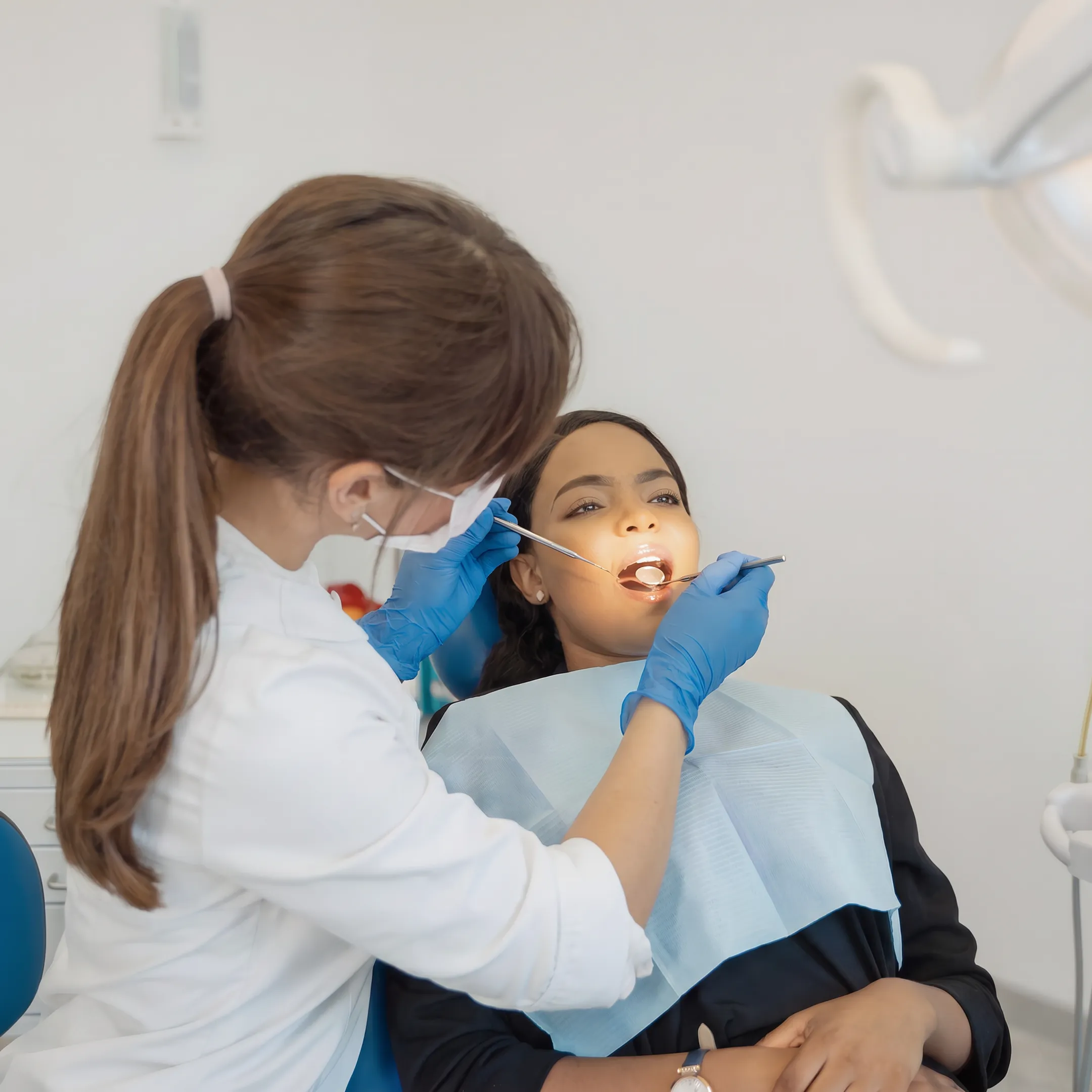 Patient receiving a dental checkup from a dentist