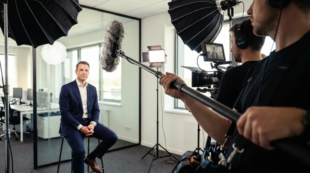 Professional video production audio setup with boom microphone and recording equipment on set