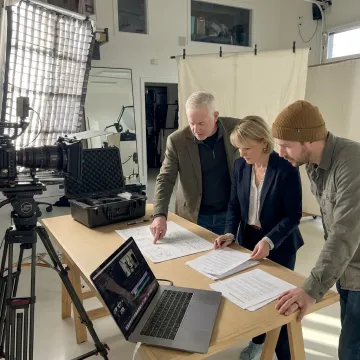 Video production team planning a shoot