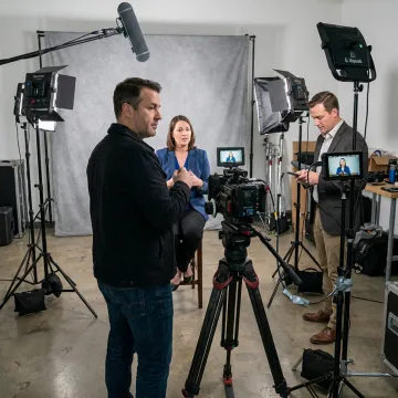 Video producer directing a corporate interview shoot